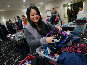 Owner Kathy Ly tries her best to keep things organized at the Ly Sports pop-up store located in the Best Western Hotel in Windsor on Dec. 8, 2016.