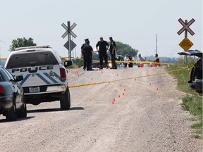 OPP investigate a fatal accident between a minivan and a CP freight train on Strong Road near County Road 42 in Lakeshore on June 10, 2012.