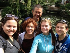 Paul Bisson, behind, with his family — Nicole, left, wife Karen, Natalie and Eric.