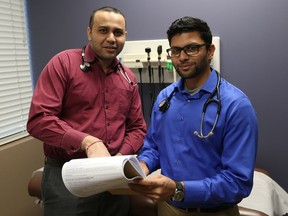 Family physicians Dr. Rushi Parikh, left, and Dr. Chintan Shah, seen here on Dec. 1, 2016 at their Roseville Garden Family Practice and Walk-In Clinic, are trying to bring in new patients with some incentives.