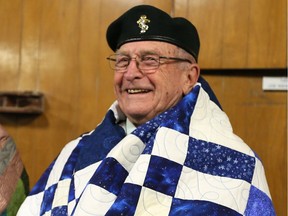 Korean War veteran Pete Remdenok was all smiles after receiving his quilt from Quilts of Valour along with Robert Goyeau and 10 other local veterans of the Canadian Armed Forces who served in Korea in the 1950s. The ceremony was held on Dec. 14, 2016 at Royal Canadian Legion Branch 255 on Wyandotte Street East.