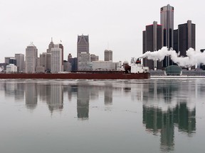 James R. Barker, a 1,000-foot bulk carrier, heads downstream on the Detroit River past the port of Windsor and Detroit on Dec. 16,2016.