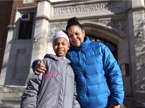 Ayla Wilson, left, and her grandmother Tondalee Wilson are shown in front of Queen Victoria Public School on Dec. 19, 2016. The two are homeless after fire destroyed their Goyeau Street apartment on Dec. 12, 2016.