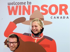 Swiss swimmer Maria Ugolkova and her coach Pablo Kutscher have their photo taken with a Welcome to Windsor sign after arriving at Windsor Airport on Dec. 2, 2016. The two are part of the Swiss team competing at the 2016 FINA World Swimming Championships at the WFCU Centre.