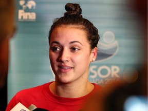 Olympic medallist Kylie Masse of LaSalle speaks with the media following her last training laps for the FINA world championships at the WFCU Centre on Dec. 5, 2016.
