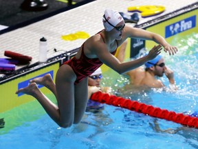 Windsor, Ontario. December 5, 2016.   Olympic medalist Kylie Masse of LaSalle enters the water for her last training laps at FINA pool located at WFCU Centre Dec. 5, 2016.  Competition runs Tuesday through Sunday.