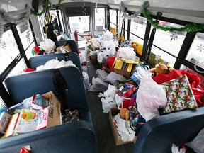 Santa’s School Bus and Toy Drive made a final stop at H.J. Lassaline, where students  crammed toys and tins of food onto school buses on Friday, Dec. 9, 2016.