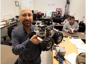 University of Windsor Electrical and Computer Engineering professor Kemal Tepe displays an autonomous robot in the research lab at the Ed Lumley Centre for Engineering Innovation in Windsor, Ontario on November 30, 2016.