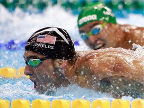 Michael Phelps, left, of the United States leads Chad le Clos of South Africa in the men's 200m butterfly final on Day 4 of the Rio 2016 Olympic Games at the Olympic Aquatics Stadium on Aug. 9, 2016 in Rio de Janeiro, Brazil.