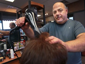 Hairstylist Youssef Gereige is shown at his Tecumseh  shop on Dec. 1, 2016.