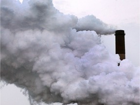 Smoke pours out of a stack on Zug Island on Feb. 26, 2015. The United States accounts for 15 per cent of global emissions while Canada produces 1.7 per cent.