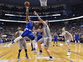 Toronto Raptors guard DeMar DeRozan (10) drives past Boston Celtics centre Kelly Olynyk (41) during second half NBA basketball action in Toronto on Tuesday, January 10, 2017. THE CANADIAN PRESS/Nathan Denette