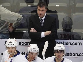 New York Islanders head coach Jack Capuano reacts after the Colorado Avalanche scored a goal in the first period of an NHL hockey game Friday, Jan. 6, 2017, in Denver. Capuano is out as head coach of the New York Islanders.The team says assistant general manager Doug Weight will take over on an interim basis. THE CANADIAN PRESS/AP/David Zalubowski