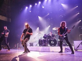 FILE - In this Thursday, Dec. 15, 2016, file photo, Metallica performs at The Fonda in Los Angeles. John Legend, Carrie Underwood, Keith Urban and Metallica are set to perform at the Grammy Awards on Feb. 12, 2017. (Photo by Rich Fury/Invision/AP, File)