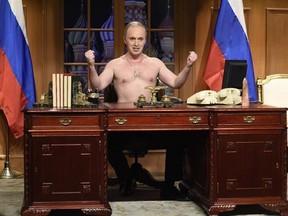 This image released by NBC shows Beck Bennett as Russian President Vladimir Putin during the opening sketch on &ampquot;Saturday Night Live,&ampquot; Saturday, Jan. 21, 2017, in New York. Alec Baldwin&#039;s piercing Trump impersonation was absent for Saturday&#039;s edition, making way for cast member Beck Bennett&#039;s shirtless portrayal of Russian leader Vladimir Putin. (Will Heath/NBC via AP)