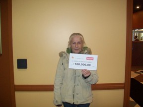 Debra Hillman of Comber won $100,000 playing the Instant 25X Merry game.