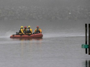 A boat carrying a recovery team rides on the shoreline of Lake Erie, Tuesday, Jan. 3, 2017, in Cleveland. Cleveland officials say the search for a plane carrying six people that disappeared last week over Lake Erie has resumed. Tuesday marks the third straight day that conditions have allowed recovery teams to search the lake for a Columbus-bound Cessna 525 Citation that vanished from radar shortly after takeoff Thursday night from Burke Lakefront Airport. (AP Photo/Tony Dejak)