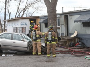 Windsor firefighters remain on the scene of a mobile home fire on Barracuda St. in Windsor, Ontario on January 26, 2017. Two dogs were rescued by neighbours after seeing smoke coming from the residence. Windsor Police, Windsor-Essex EMS Paramedics, and Windsor Fire Service responded to the scene. Police are investigating. The residents were not home at the time of the fire.