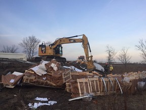 Crews clean up following an early-morning crash on the E.C. Row eastbound off ramp at Lauzon Parkway.