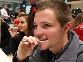 From right, Jarrod Anderson, 19, and Katrina Brookbanks, 19, provide swab samples to see if they are a match for five-month-old Madalayna Ducharme who urgently needs a bone marrow transplant. A 'get-swabbed' event was held at the St. Clair College main campus on January 26, 2017. A second 'get-swabbed' event will take place on Saturday, January 28, 2017 at the Windsor Canadian Blood Services.