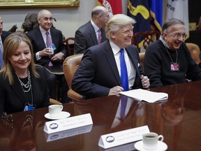 President Donald Trump meets with CEO of General Motors Mary Barra (L), CEO of Fiat Chrysler Automobiles Sergio Marchionne (R) and other auto industry leaders in the Roosevelt Room of the White House on January 24, 2017 in Washington, DC. President Trump has a full day of meetings including one with Senate Majority Leader Mitch McConnell and another with the full Senate leadership.