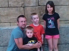 Adam Pouget and three of his four kids are pictured in this handout photo.