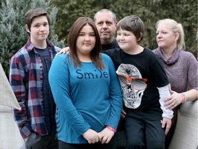 Paige Grossutti, 14, centre left, is surrounded by parents Kim and Gary and brothers Mitchell, 16, left, and Riley, 9, on Jan. 19, 2017.