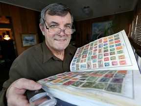 Herb Colling, local writer and retired CBC reporter and broadcaster, has recently become editor of The Canadian Philatelist which publishes six times per year. Colling poses with a small portion of his stamp collection on  Jan. 4, 2017.