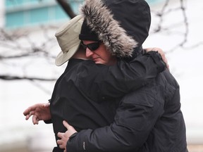 Jeff Durham, right, is hugged by an uncle of murder victim Cassandra Kaake outside of Superior Court of Justice in Windsor on Jan. 23, 2017 where a sentencing hearing for Matthew Brush was being held. Durham was the father of the baby Kaake was carrying.