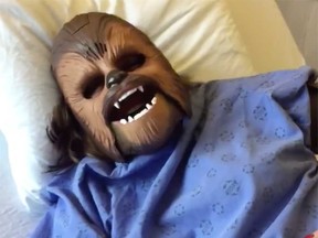 Katie Stricker Curtis wears a noise-making Chewbacca mask while waiting to give birth at Windsor Regional Hospital on Jan. 2, 2017. The image comes from a Facebook video that has gone viral, with more than 735,000 views and an appearance on NBC's Today Show.