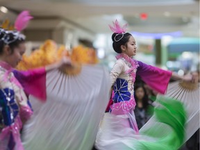 Katie Gao, 14, left, and Patricia Guo, 12, perform at the 2017 Chinese New Year Celebration at Devonshire Mall, Sunday, Jan. 29, 2017. The event was organized by the Essex County Chinese Canadian Association.