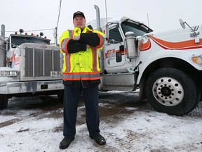 Brad Coxon, owner of CTS Coxon's Towing Services Ltd., stands by trucks at the company's Windsor location. The company is one of the featured tow operators on the Discovery Channel reality TV show Heavy Rescue: 401.