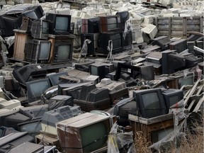 The GEEP electronics recycling centre sits behind a mountain of waiting dead electronics at the Edmonton Waste Management Facility in this Nov. 15th, 2008 file photo.