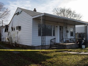 Caution tape surrounds a home at 1341 Curry Ave., after an early morning fire that sent one man to hospital in critical condition, Saturday, Jan. 21, 2017.