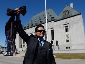 Gabriel Daniels, son of the late Harry Daniels, reacts as he leaves the Supreme Court of Canada in Ottawa on April 14, 2016, after it ruled that Metis are indigenous people the federal government owes a fiduciary duty under the Constitution. The Congress of Aboriginal Peoples joined with several individuals, including Metis leader Harry Daniels, in taking the federal government to court in 1999 to allege discrimination because they were not considered "Indians" under the Constitution.