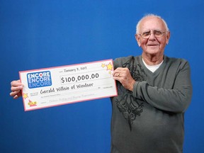 Gerald Willsie of Windsor holds up his $100,000 prize cheque from playing Encore. He found out about his win on Dec. 31, 2016.