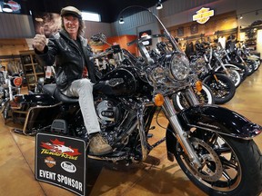 Randall Campbell of Windsor sits atop the Harley-Davidson he won in the Windsor Youth Centre’s Harley-Davidson lottery.