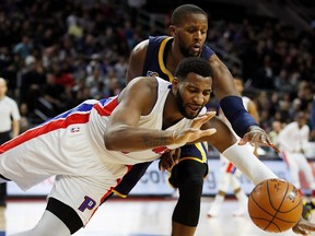 Andre Drummond of the Detroit Pistons, front, battles for the ball with C.J. Miles of the Indiana Pacers during the second half at the Palace of Auburn Hills on Jan. 3, 2017 in Auburn Hills, Mich. Indiana won the game 121-116.