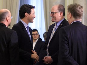 Canadian Prime Minister Justin Trudeau talks with Windsor Mayor Drew Dilkens during the big-city mayors meeting in Ottawa on Jan. 20, 2017.