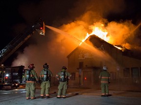 Essex firefighters battle a blaze at the Story Book Early Learning Centre at 26 Arthur Ave. in Essex, Ont. on Jan. 7, 2017.
