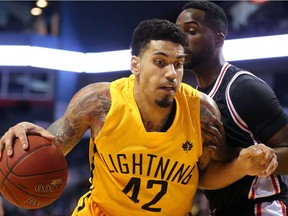 Julian Boyd drives to the net against Warren Ward of the Windsor Express during their Sunday January 15, 2017 game at Budweiser Gardens in London, Ont.  The Lightning had a shaky start forcing a quick timeout, but ended up with a 50-42 lead at the half, with Ryan Anderson of the Lighting getting hot from three-point land.