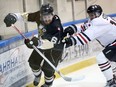 LaSalle Vipers Cale Allen, left, looks for space against Sarnia Legionnaires Brett Storr in Greater Ontario Junior Hockey League action at the Vollmer Centre on Jan. 25, 2017.