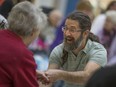 Christopher Lyons, right, leads the Laugh Out Loud event presented by Seasons Retirement Communities in support of the Alzheimer Society Windsor-Essex County at Devonshire Mall Jan. 28, 2017.