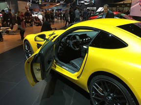 Attendees of the North American International Auto Show check out a Mercedes-AMG GT S sports car on Jan. 9, 2017. The NAIAS opens to the public from Jan. 14 to 22.