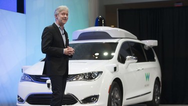 CEO of Waymo, Google's self-driving car division, John Krafcik, unveils the autonomous Chrysler Pacifica Hyrbid minivan at the North American International Auto Show at Coba Hall on Jan. 8, 2017.