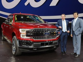 Ford Motor Co. executive chairman Bill Ford, left, and president and chief executive officer Mark Fields stand next to a new F-150 at the North American International Auto Show on Jan. 9, 2017 in Detroit, Mich.