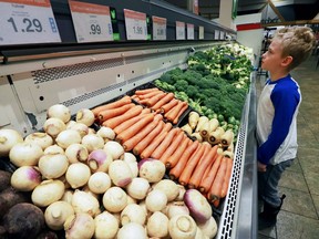 Casey Kelly a student from D.M. Eagle School checks out vegetables during a Nutrition in the Aisles tour at the Zhers store at Tecumseh and Lauzon in Windsor on Tuesday, January 17, 2017.