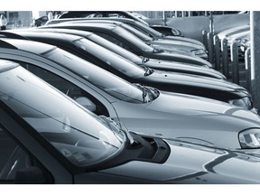 Cars with tinted windows in parking lot. Photo by Getty Images.