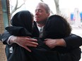 Scott Quick hugs supporters after exiting the Superior Court in Windsor, Ont. on Monday, Jan. 16, 2017 after charges were dropped in the February 2006 hit-and-run death of Nancy Galbraith-Quick.