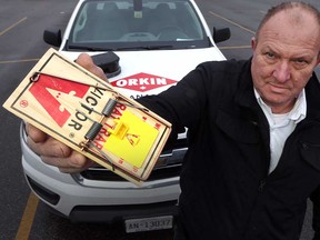 George Diepstra of the Windsor branch of Orkin Canada shows a rat trap on Jan. 24, 2017. According to Orkin Canada, Windsor is No. 7 on the list of the 25 "rattiest" cities in Ontario.